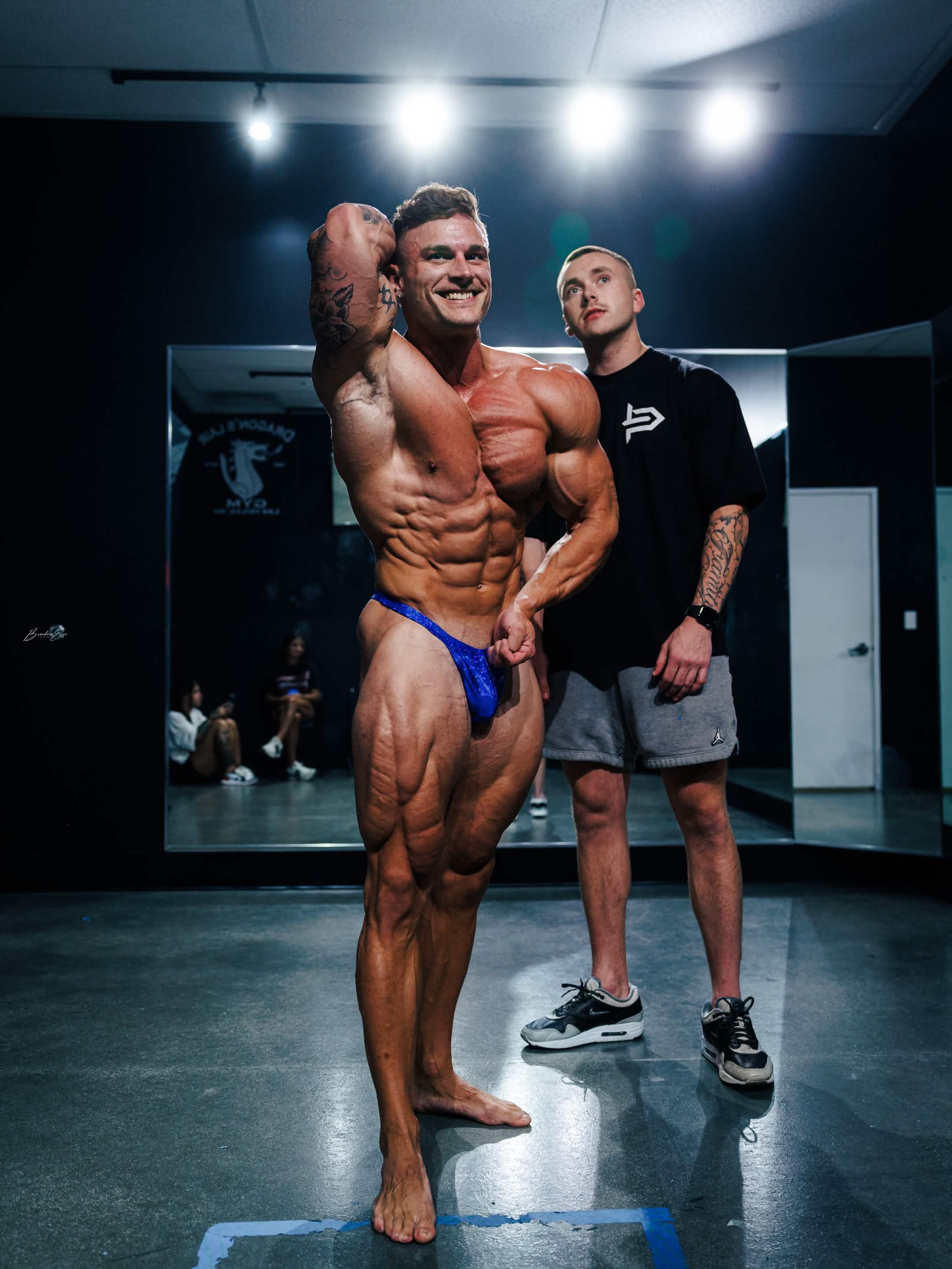 Coach posing in gym